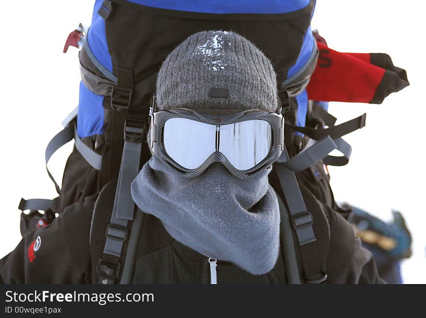 Portrait of tourist in a winter mask with a backpack. Portrait of tourist in a winter mask with a backpack