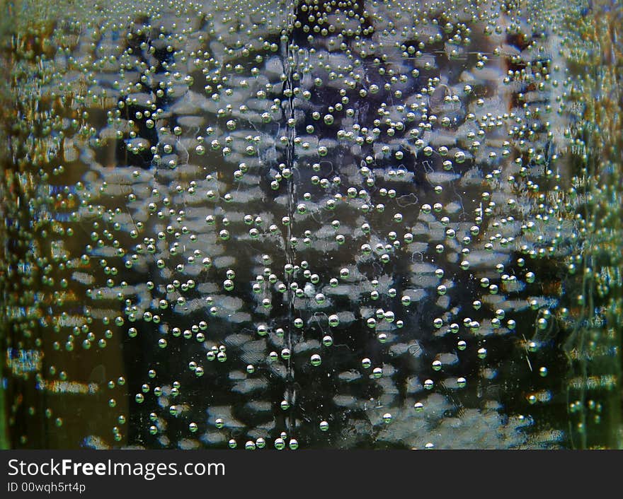 Bubbles on walls glass banks on a dark background