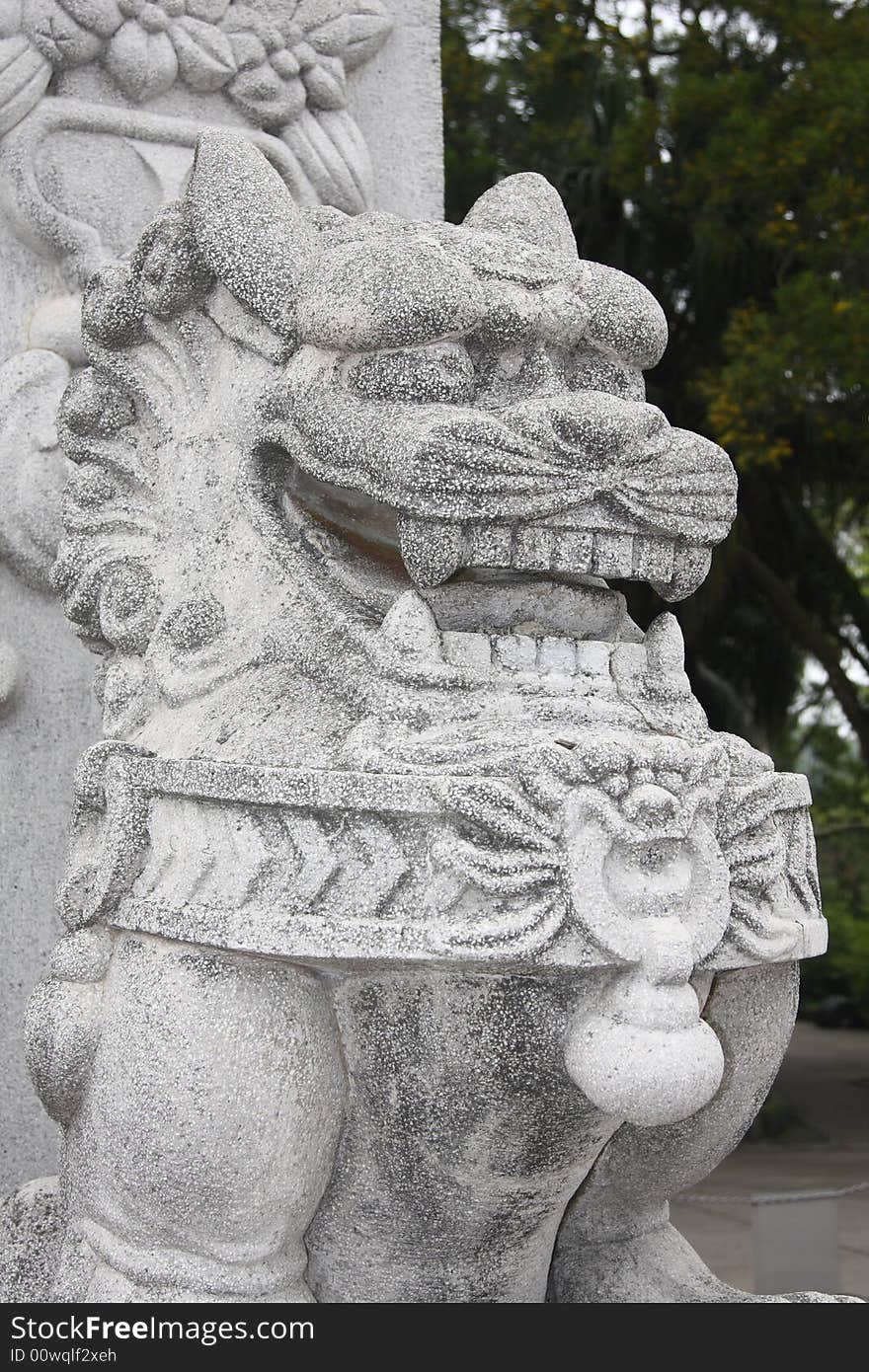 Dragon / lion carving near the Big Buddha in Hong Kong. Dragon / lion carving near the Big Buddha in Hong Kong