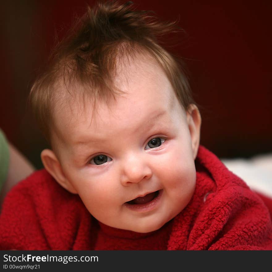 A smiling face of a four months old baby girl