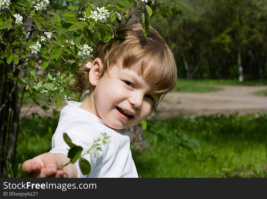 Girl demonstrating a white flower. Girl demonstrating a white flower