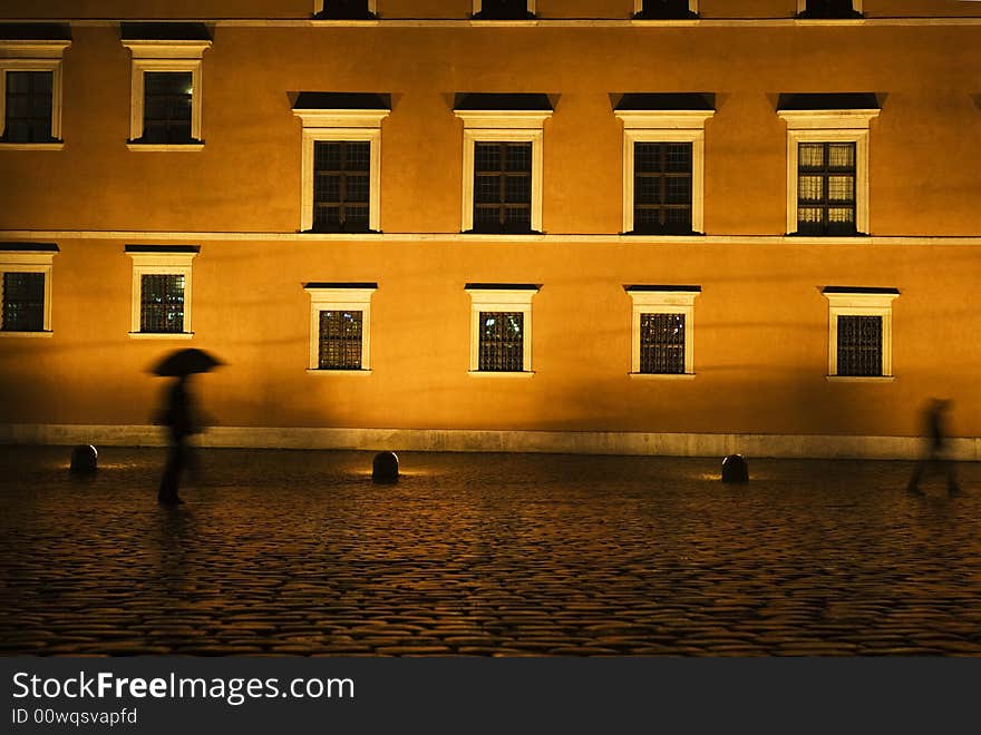 Man with umbrella at night