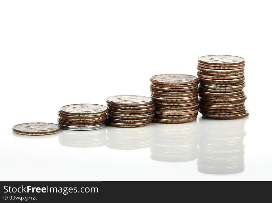 Five pile of coins forming a graphic pattern. Five pile of coins forming a graphic pattern