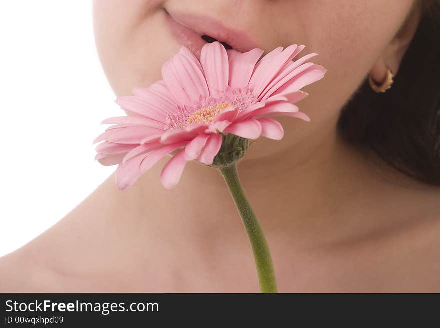 Girls lips touching a flower gently. Girls lips touching a flower gently.