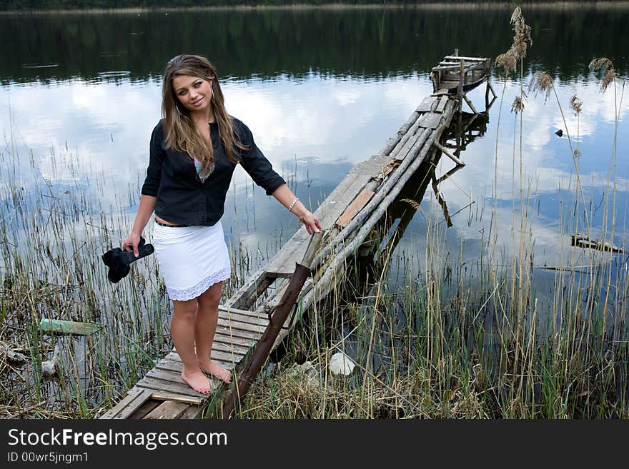 Portrait of young sexual girl on lake background