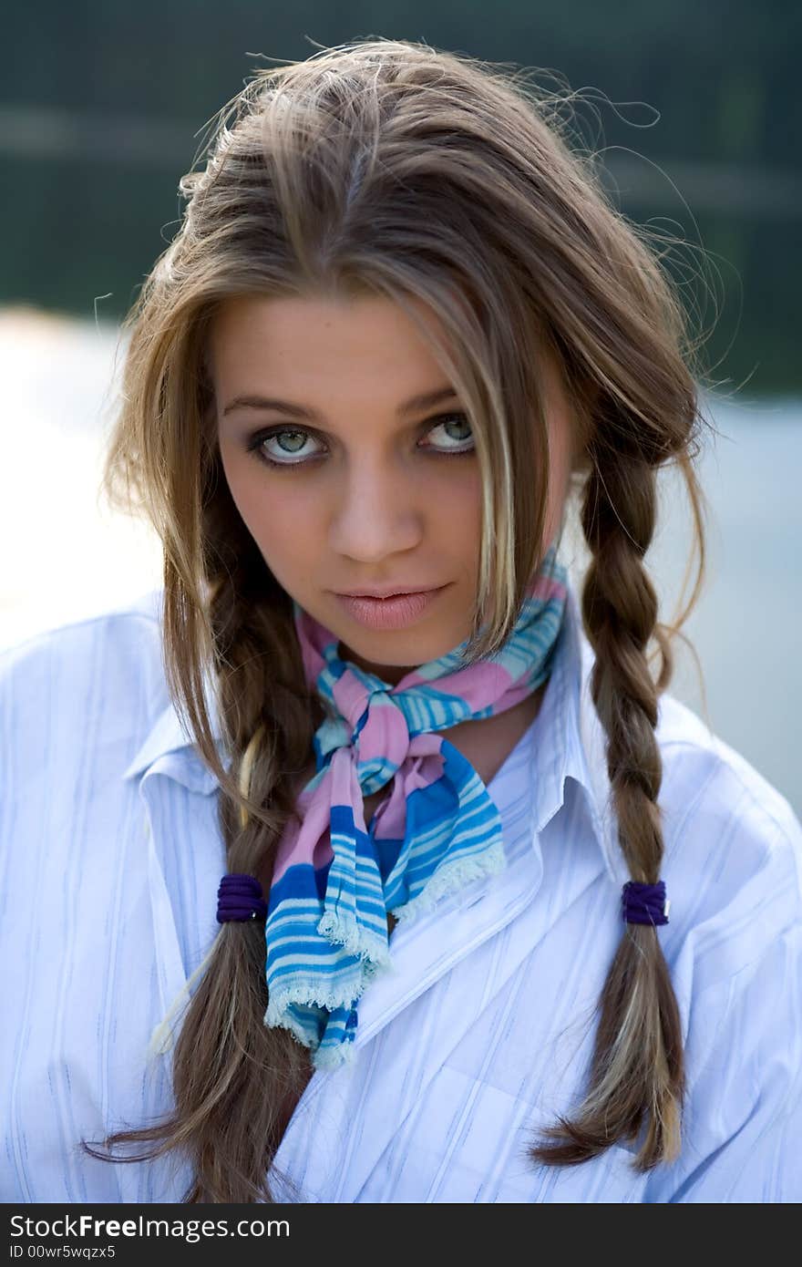 Portrait of young sexual girl on lake background