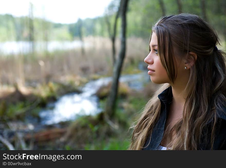 Portrait of young girl on forest background