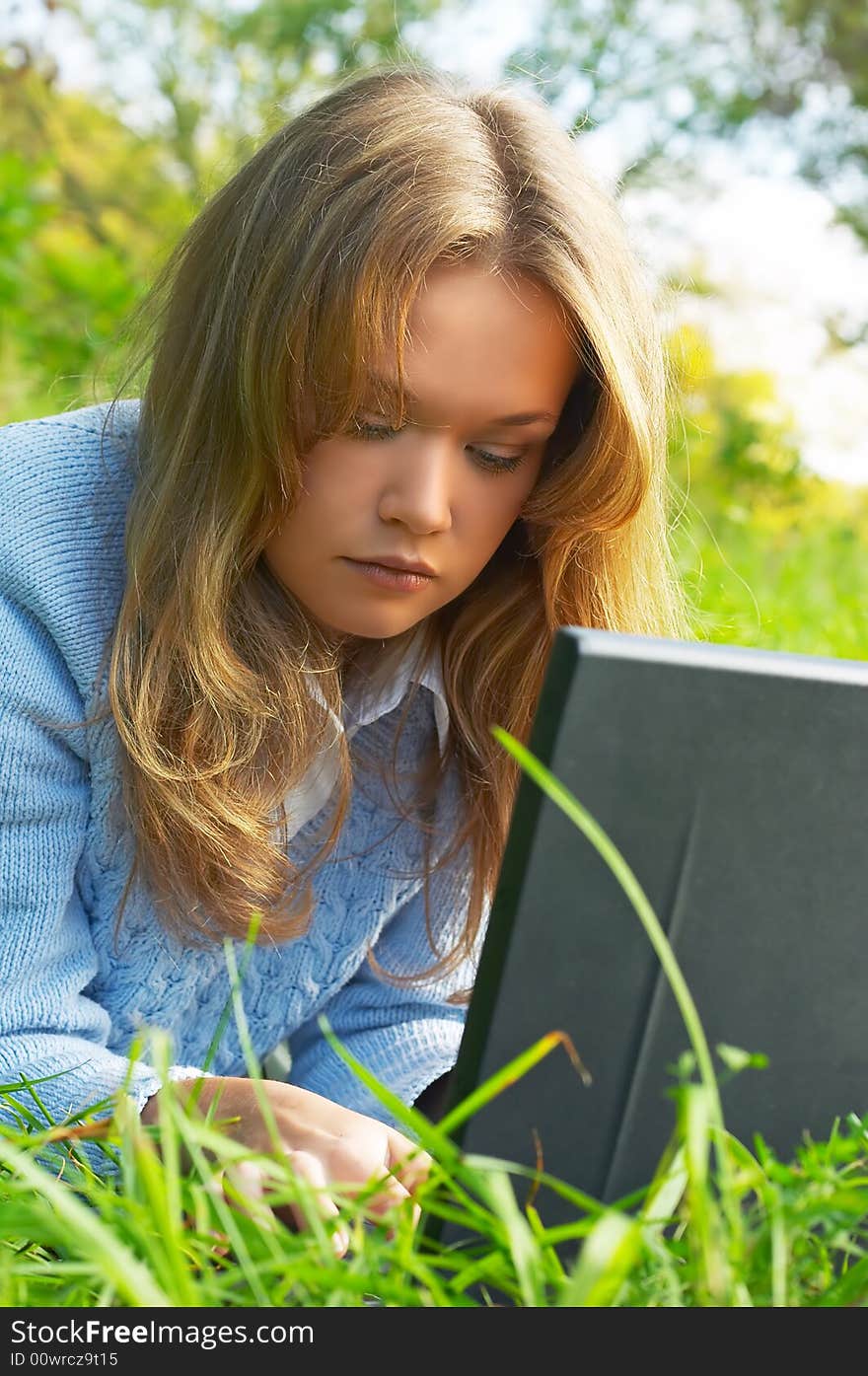 Girl Working With Notebook Outdoor