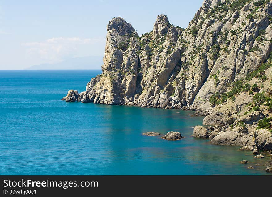 Blue sea and rocky mountains - 3