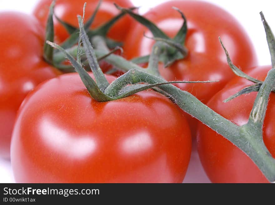 Red tomatoes isolated on white background