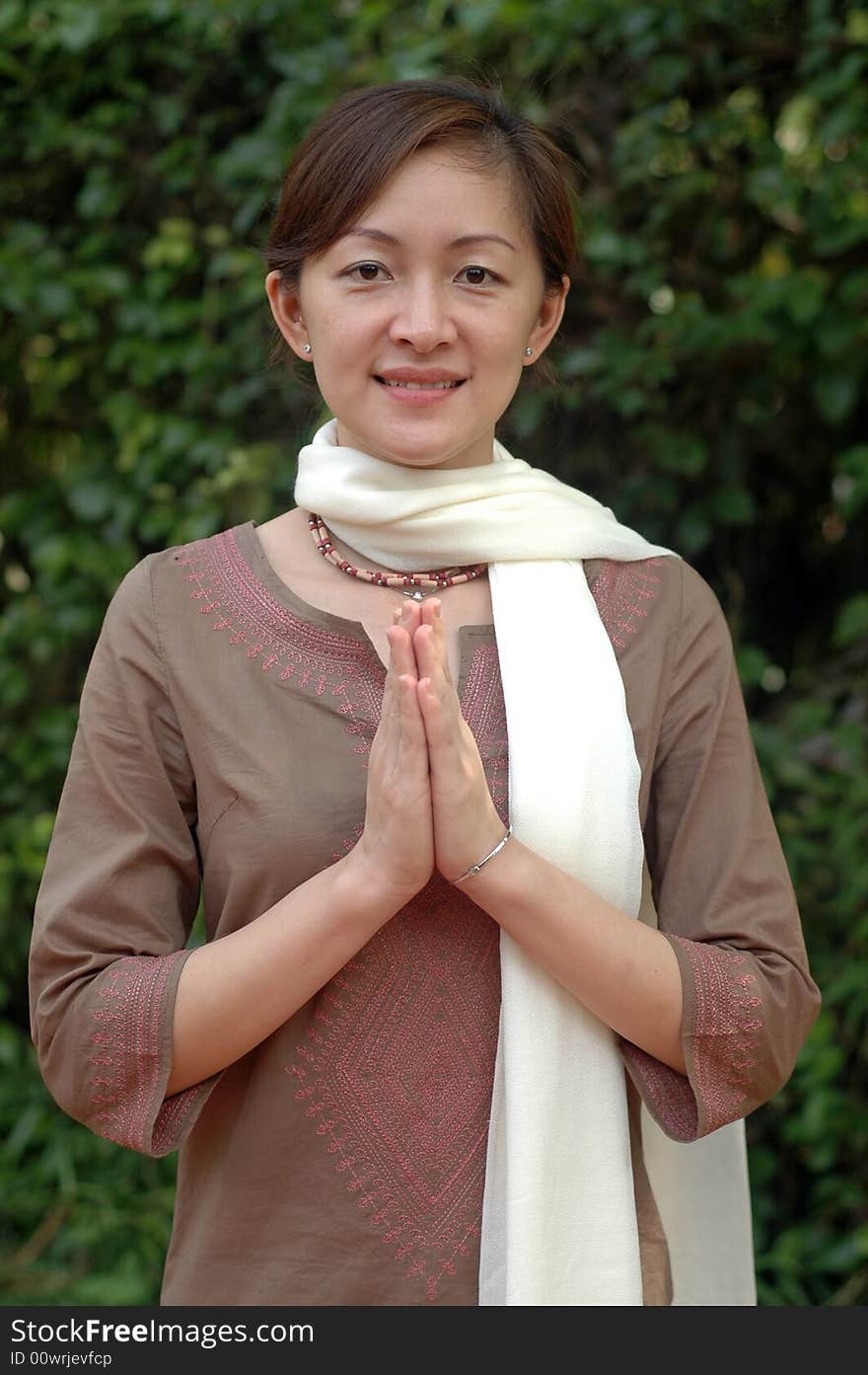 A blissful Hare Krishna Chinese devotee greeting at garden. A blissful Hare Krishna Chinese devotee greeting at garden.