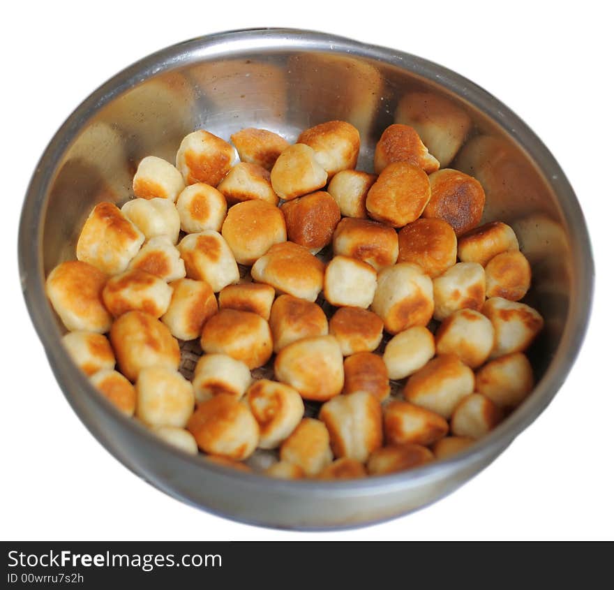 Roasted cookies at steel plate on a white background