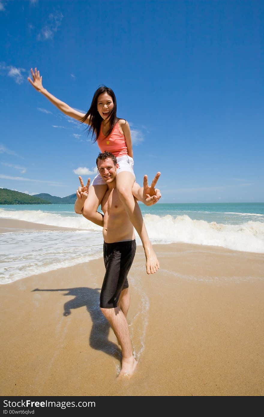 Couple playful by the beach