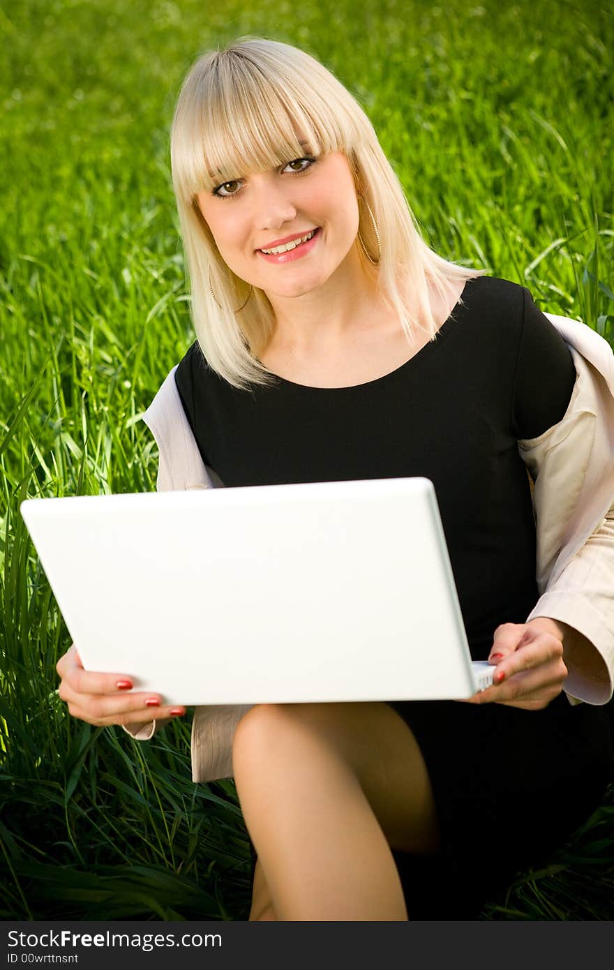 Portrait of smiling girl with laptop. Portrait of smiling girl with laptop