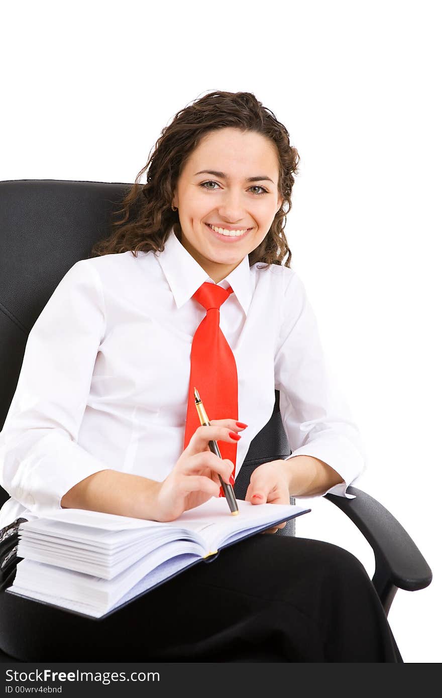 Businesswoman seat in armchair and holds pen and book. Businesswoman seat in armchair and holds pen and book