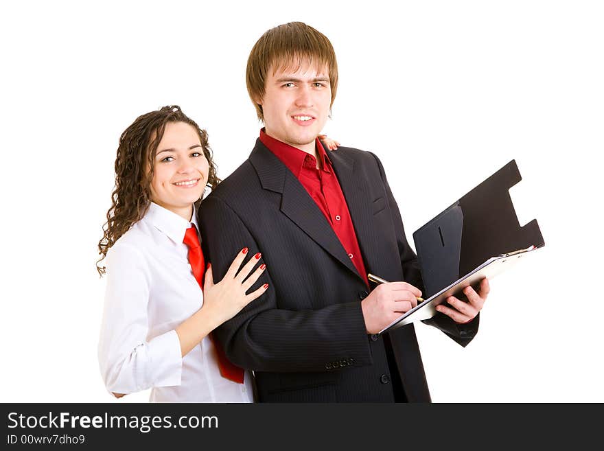 Smiling man and woman dressed for office stand with carpet. Smiling man and woman dressed for office stand with carpet