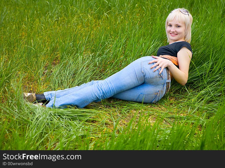 Blond beauty on the grass. Blond beauty on the grass