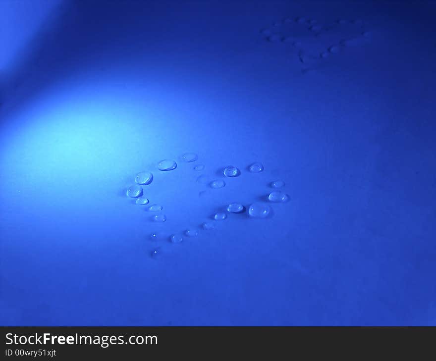 Water herat on blue table. Water herat on blue table.