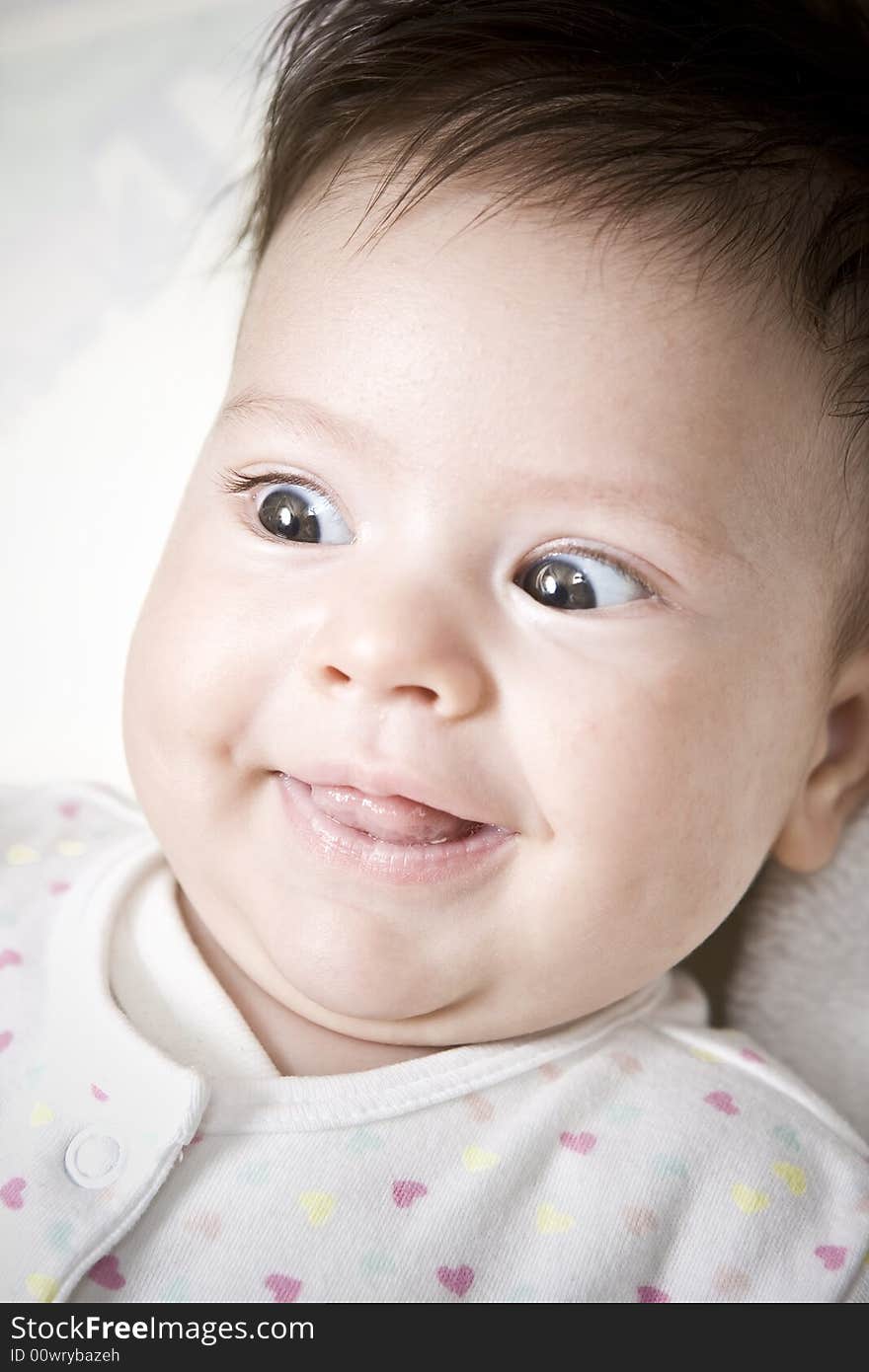 Sweet little baby girl smiling