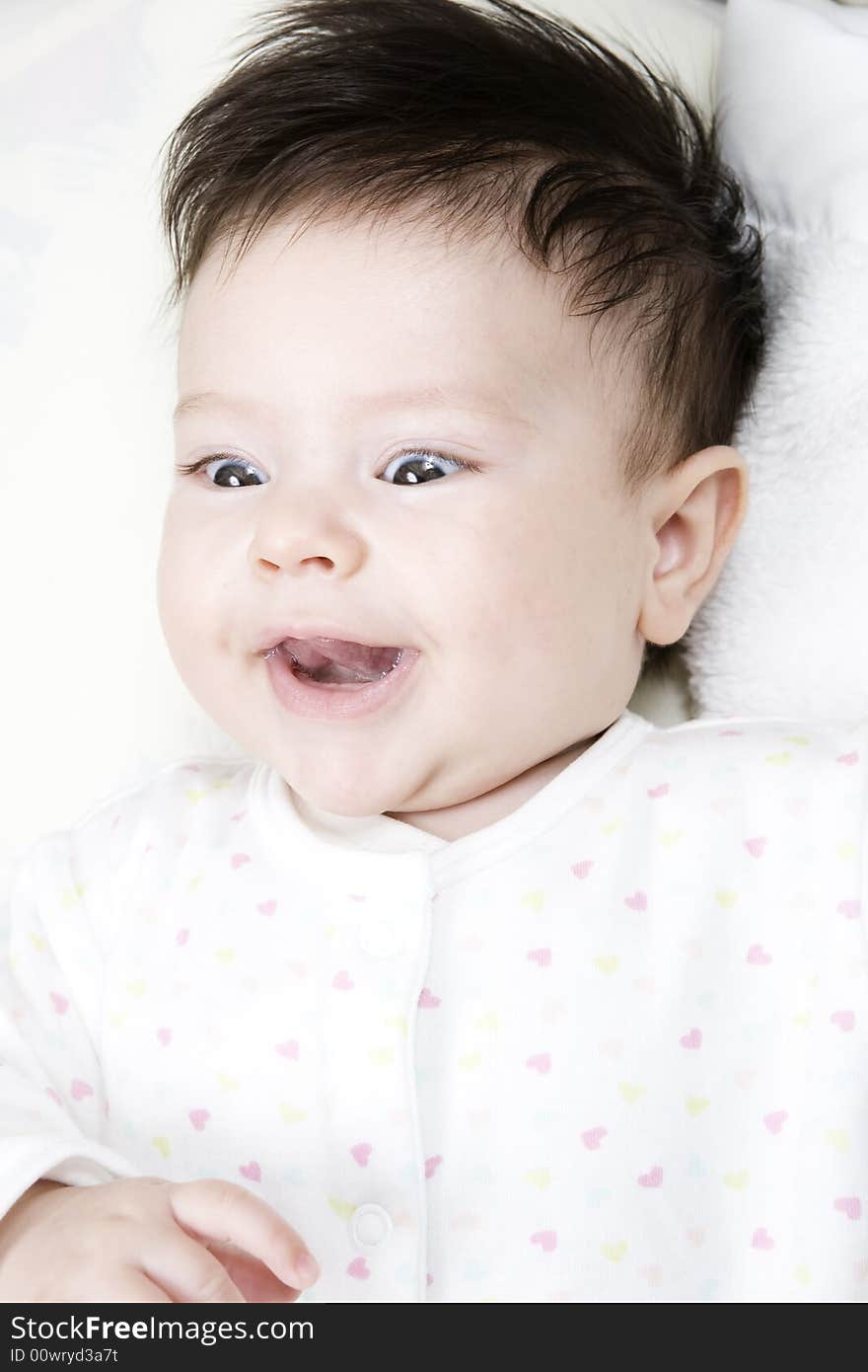 Sweet little baby girl smiling