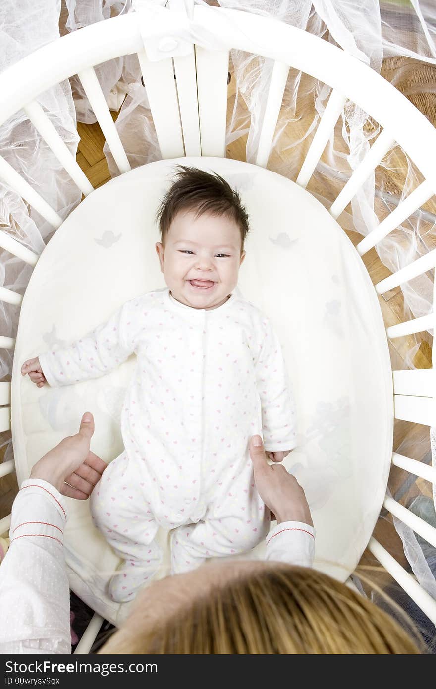 Sweet little baby smiling at her mother