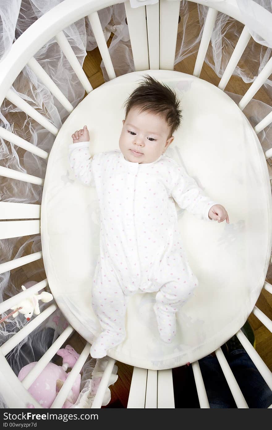 Sweet little baby laying in her bed