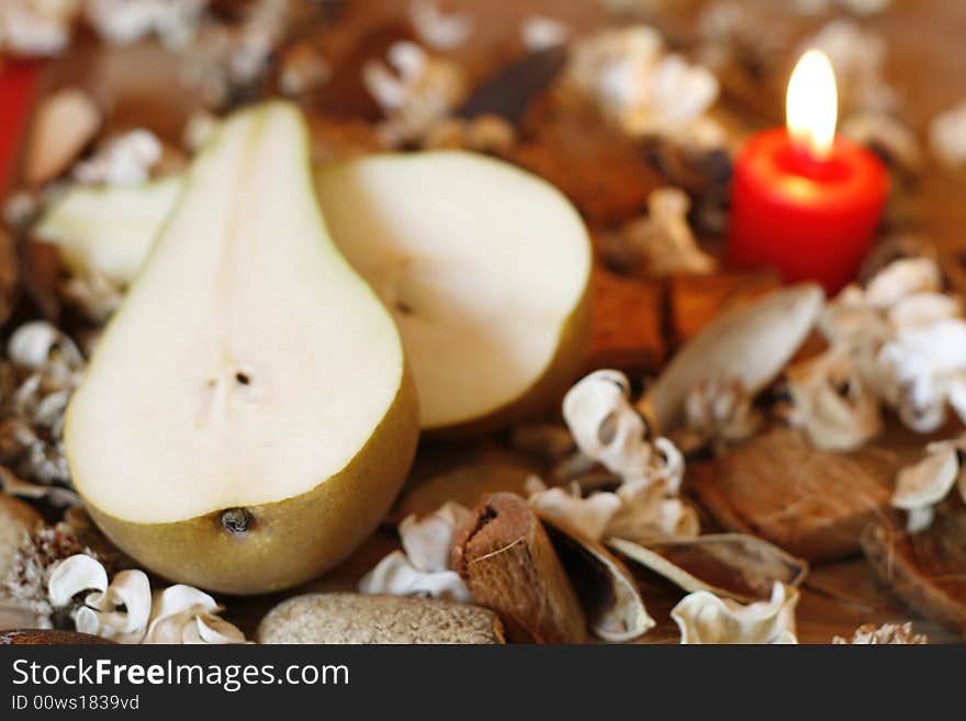 Burning Candle, Pear And Dried Plants