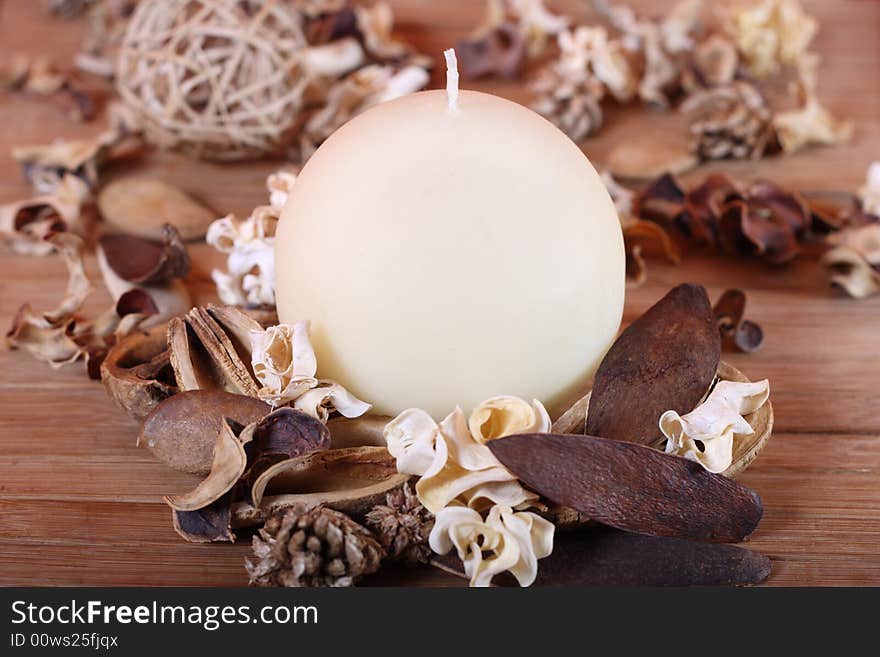 Candle and dried plants