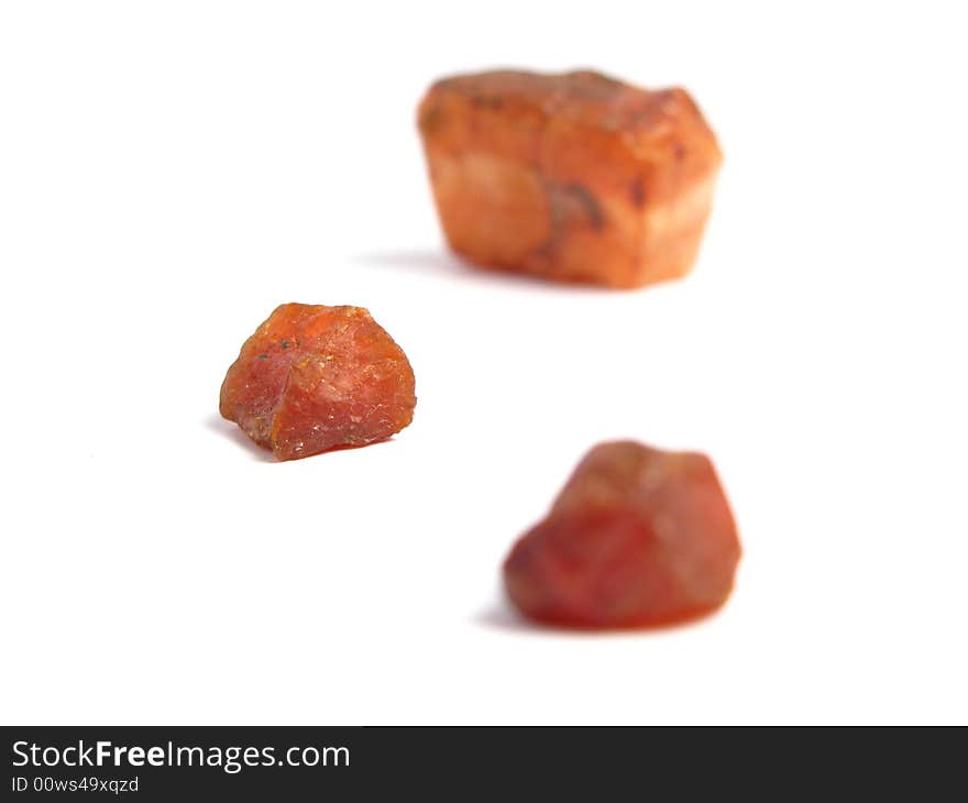 Group of red stones in a white background