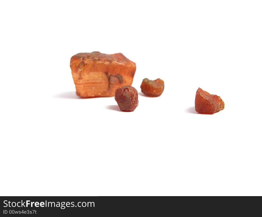 Group of red stones in a white background