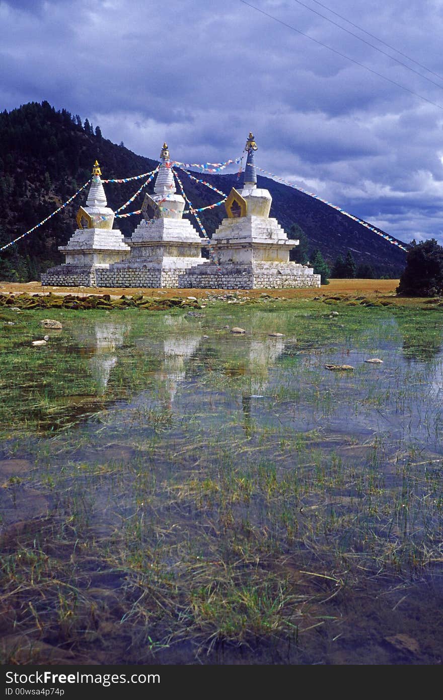 White pagodas by the lake