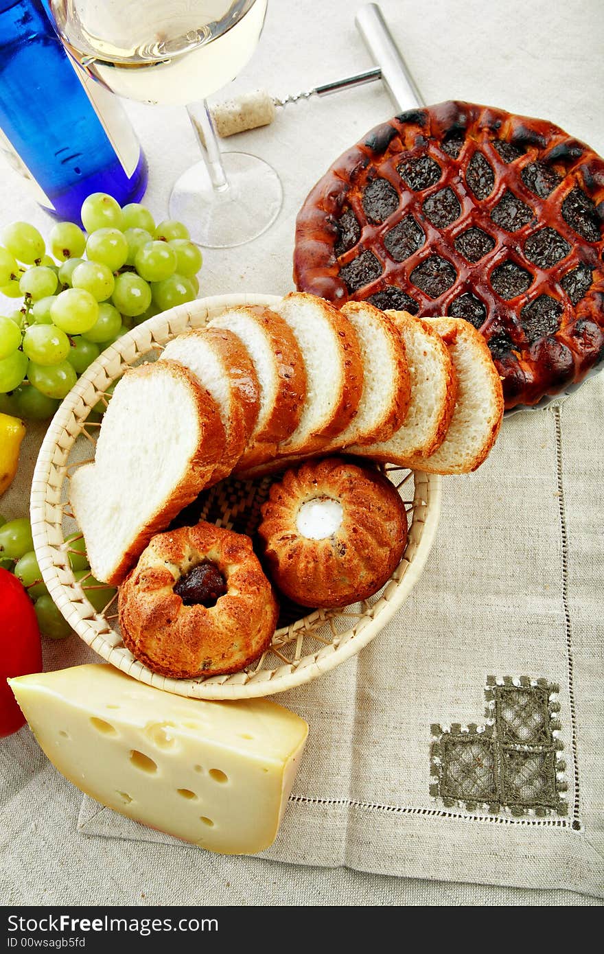 Natural form foods. Dairy produce, pastry, wine. Shot in a studio. Natural form foods. Dairy produce, pastry, wine. Shot in a studio.