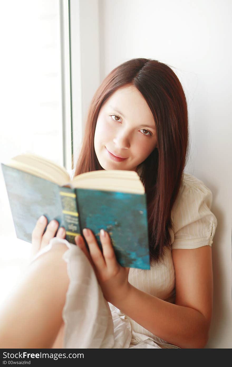 Beautiful girl with book: education, fashion. Beautiful girl with book: education, fashion.