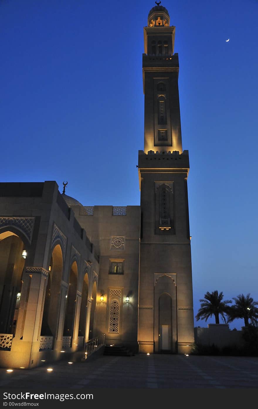 The sun has set and the call to prayer has sounded. The crescent moon is high in the sky next to the minaret of this mosque. The sun has set and the call to prayer has sounded. The crescent moon is high in the sky next to the minaret of this mosque.