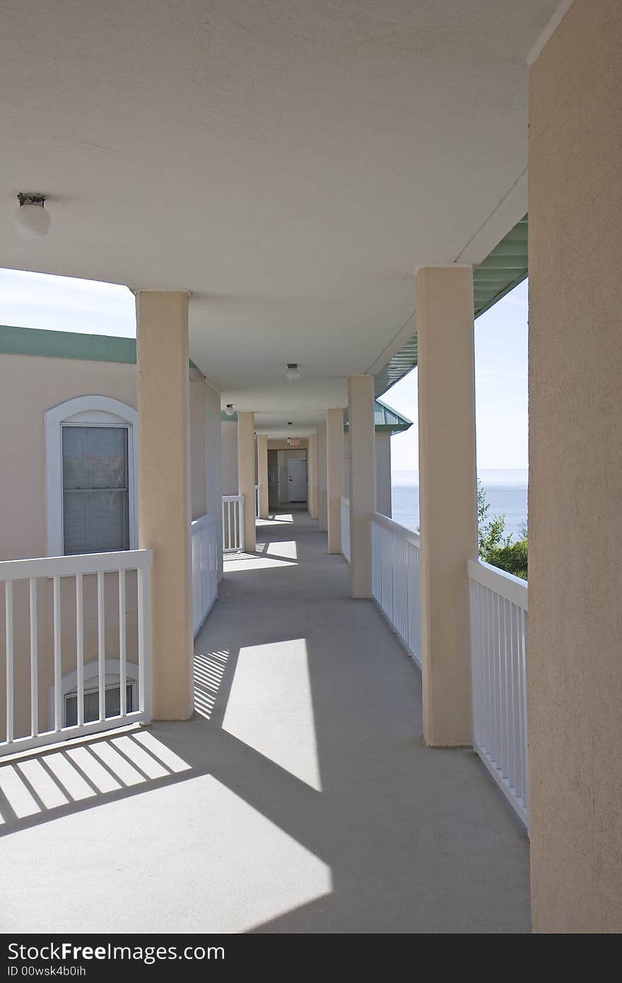 Exterior corridor of a tropical luxury condominium complex. Exterior corridor of a tropical luxury condominium complex