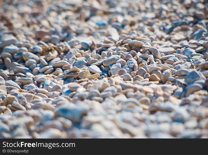 River stones background. Focus on middle. River stones background. Focus on middle.