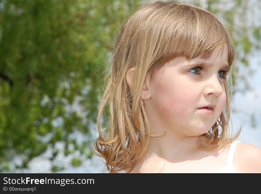 Staring little blond beautiful gril's portrait outdoors. Staring little blond beautiful gril's portrait outdoors