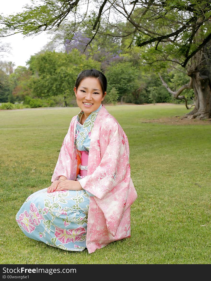 Young Asian girl in a traditional kimono. Young Asian girl in a traditional kimono