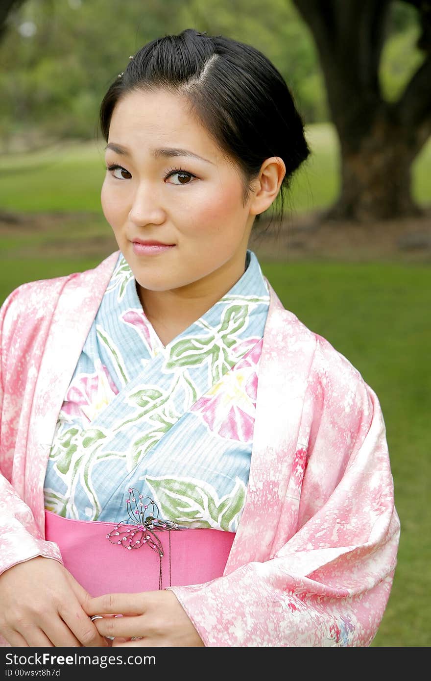 Young Asian girl in a traditional kimono. Young Asian girl in a traditional kimono