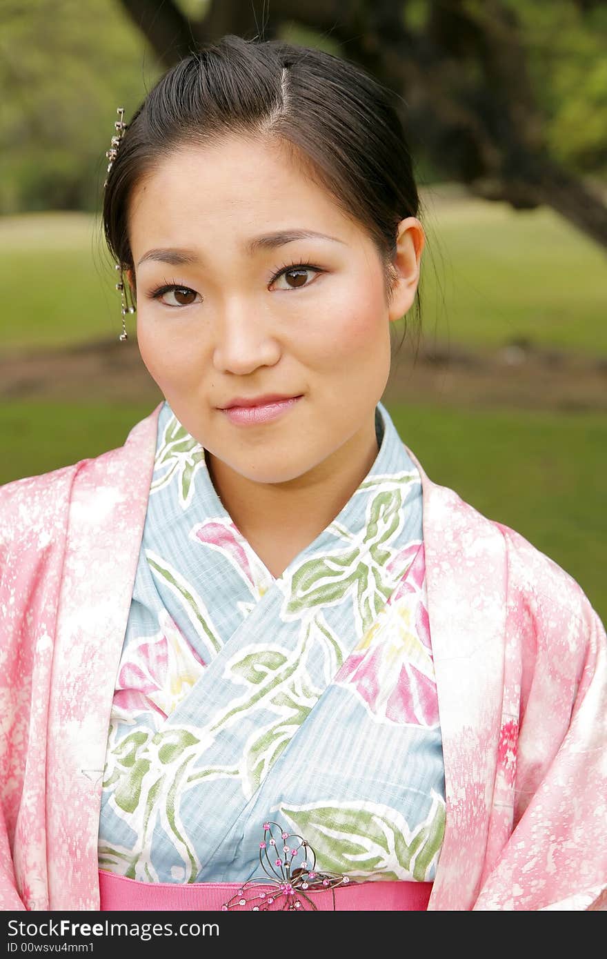 Young Asian girl in a traditional kimono. Young Asian girl in a traditional kimono