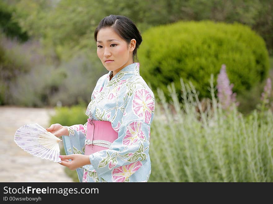 Young Asian girl in a traditional kimono. Young Asian girl in a traditional kimono