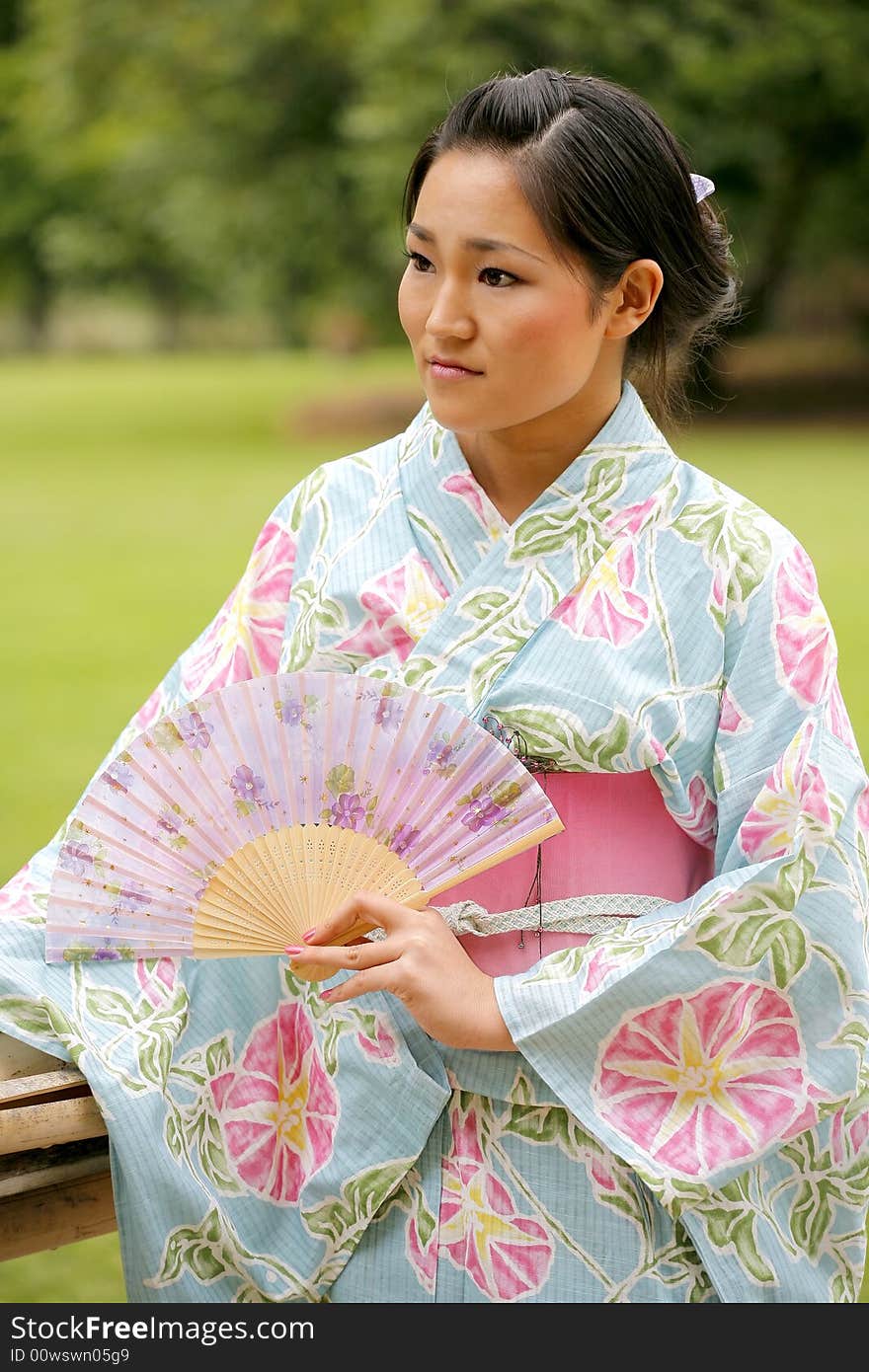 Young Asian girl in a traditional kimono. Young Asian girl in a traditional kimono