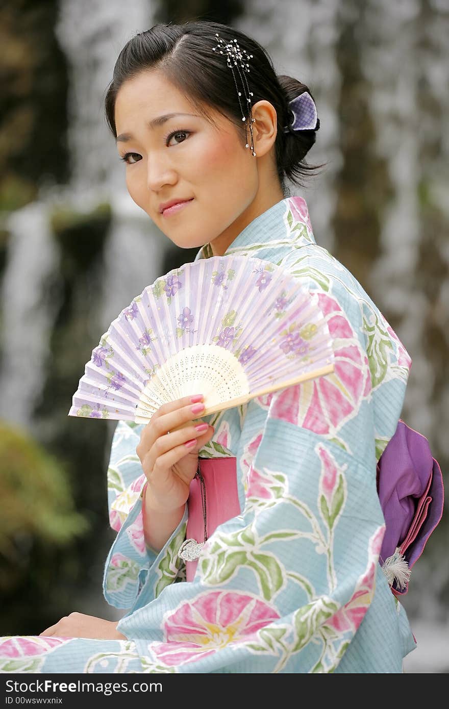 Young Asian girl in a traditional kimono. Young Asian girl in a traditional kimono