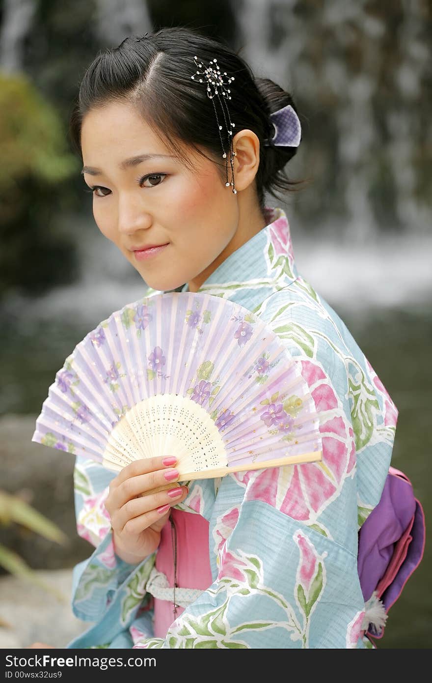 Young Asian girl in a traditional kimono. Young Asian girl in a traditional kimono