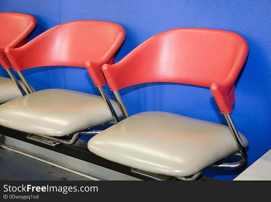 Stationary chairs found in waiting room of auto repair shop. Stationary chairs found in waiting room of auto repair shop.