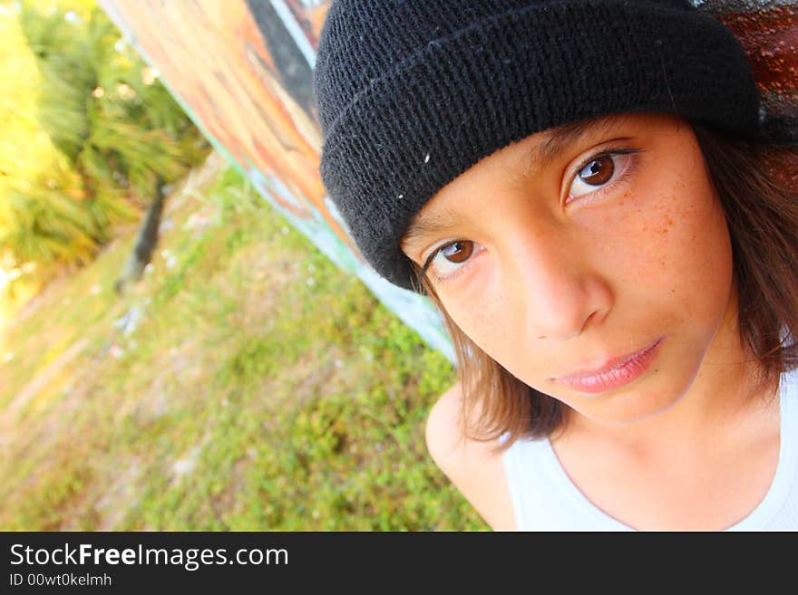 Young boy wearing a black cap. Young boy wearing a black cap