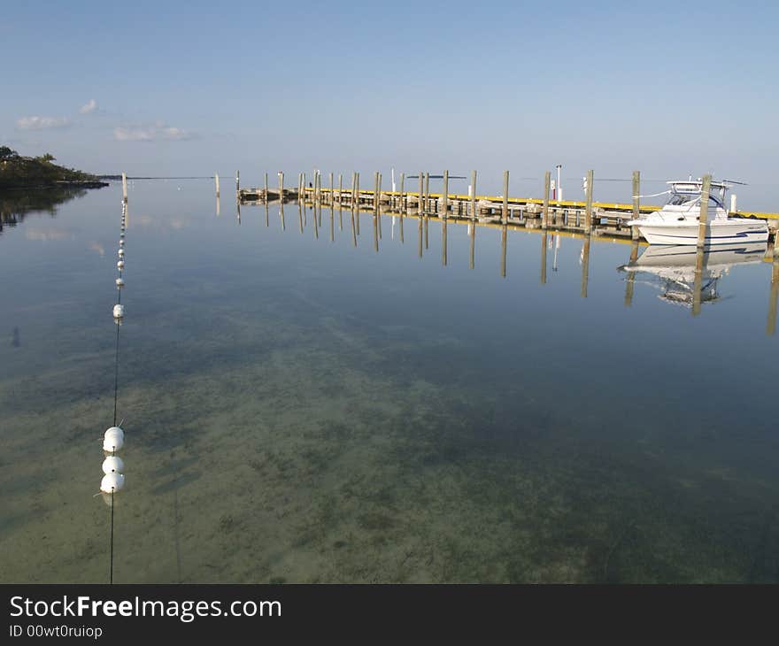 Photo taken early morning at marina in Key Largo, Florida. Water gets choppy later in the day but early morning was ripple free and crystal clear. Photo taken early morning at marina in Key Largo, Florida. Water gets choppy later in the day but early morning was ripple free and crystal clear.