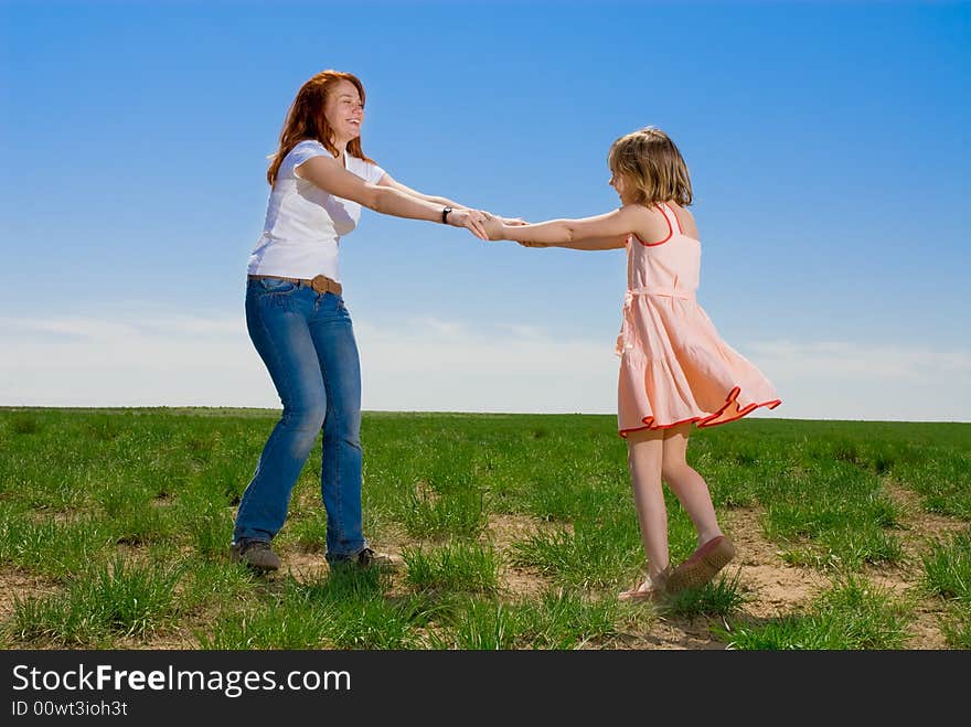 Mother and daughter whirling