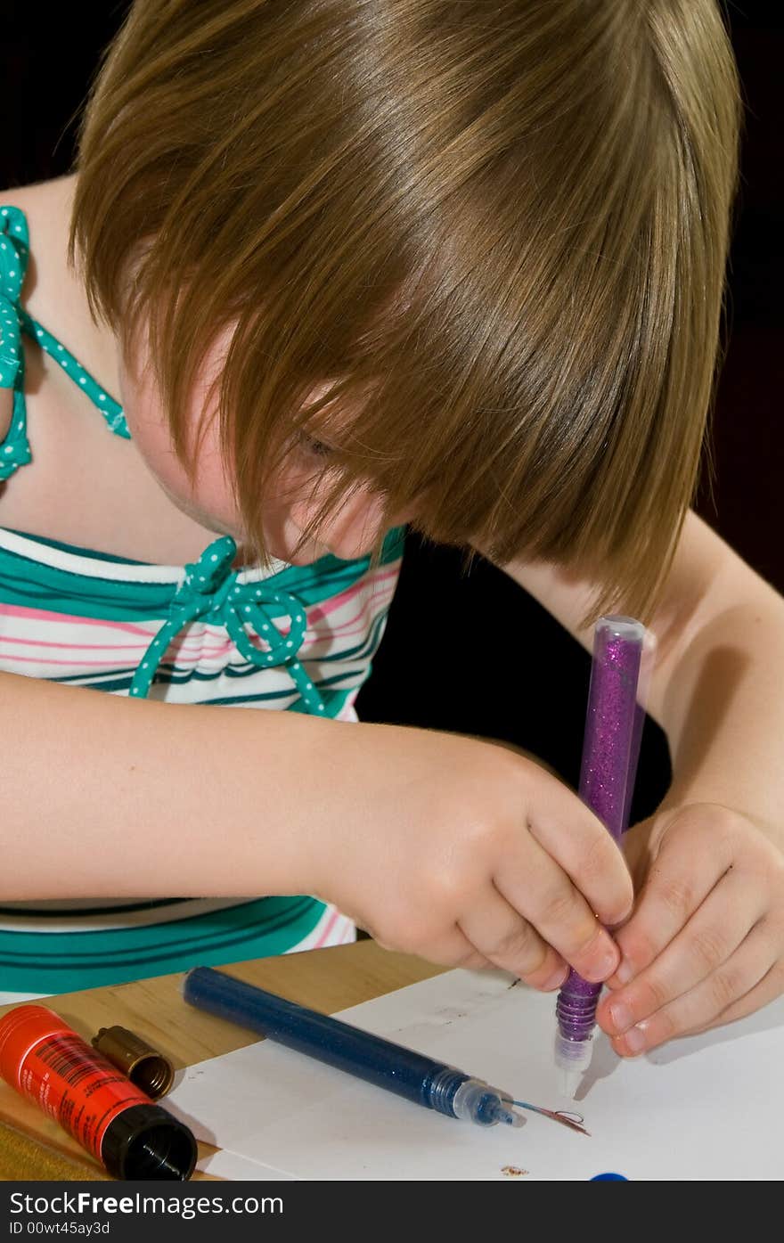 Cute little girl drawing in an education concept. Cute little girl drawing in an education concept