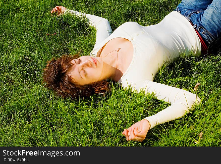 Girl is relaxing on the grass. Girl is relaxing on the grass